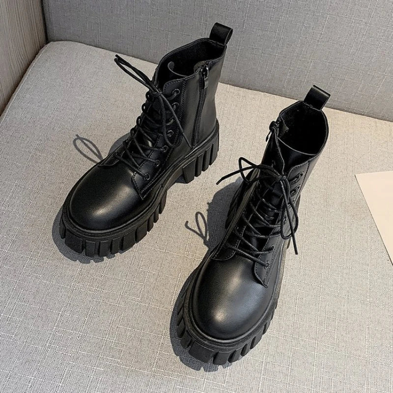 Black lace-up ankle boots with chunky ridged sole, top view