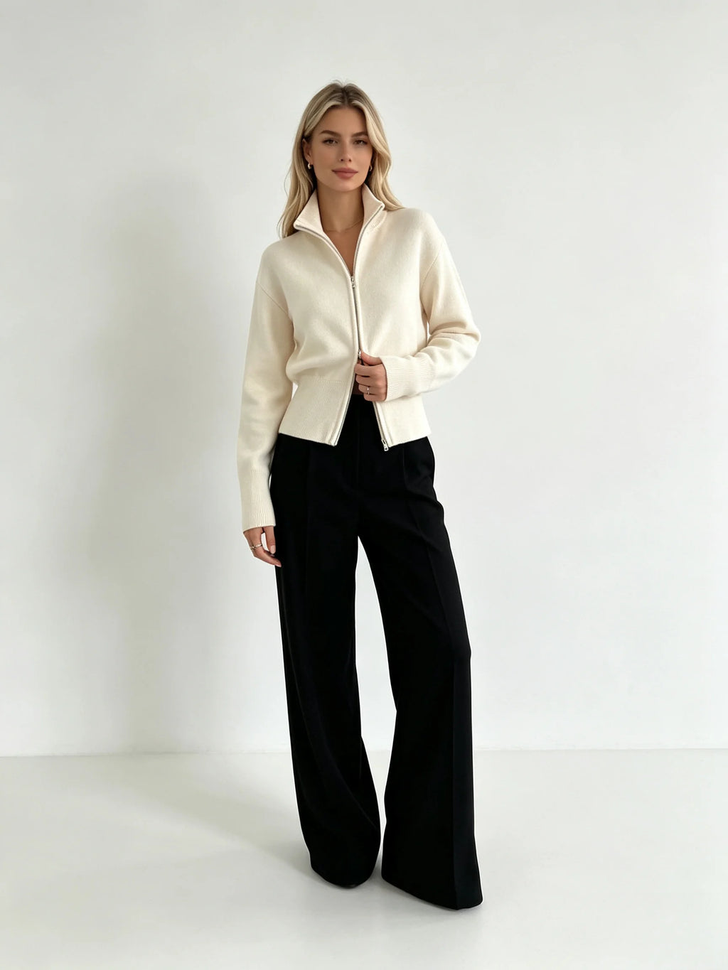 Ivory zip up cardigan with black wide-leg trousers, full-length view