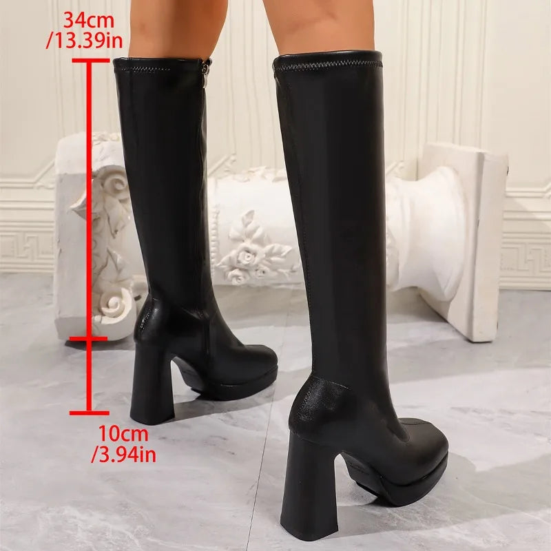 Black platform knee high boots with 34 cm shaft and 10 cm heel measurements