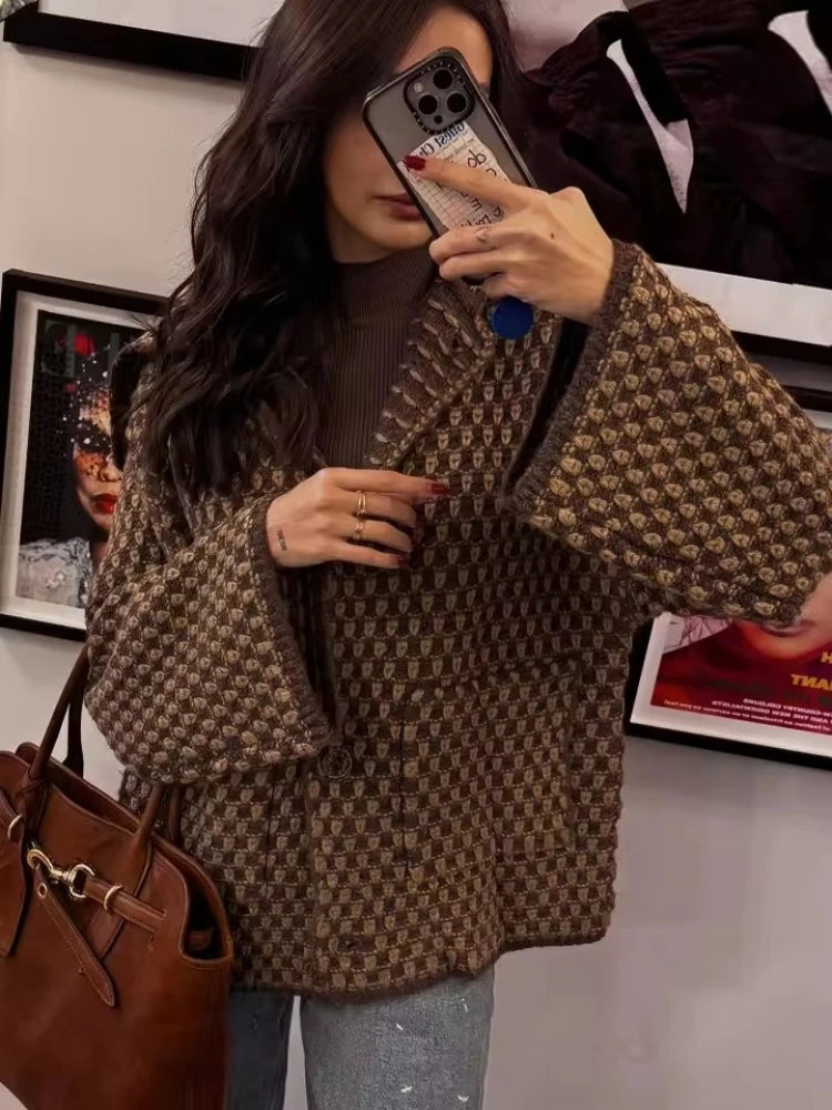 Woman wearing a brown check knit collared cardigan with wide sleeves