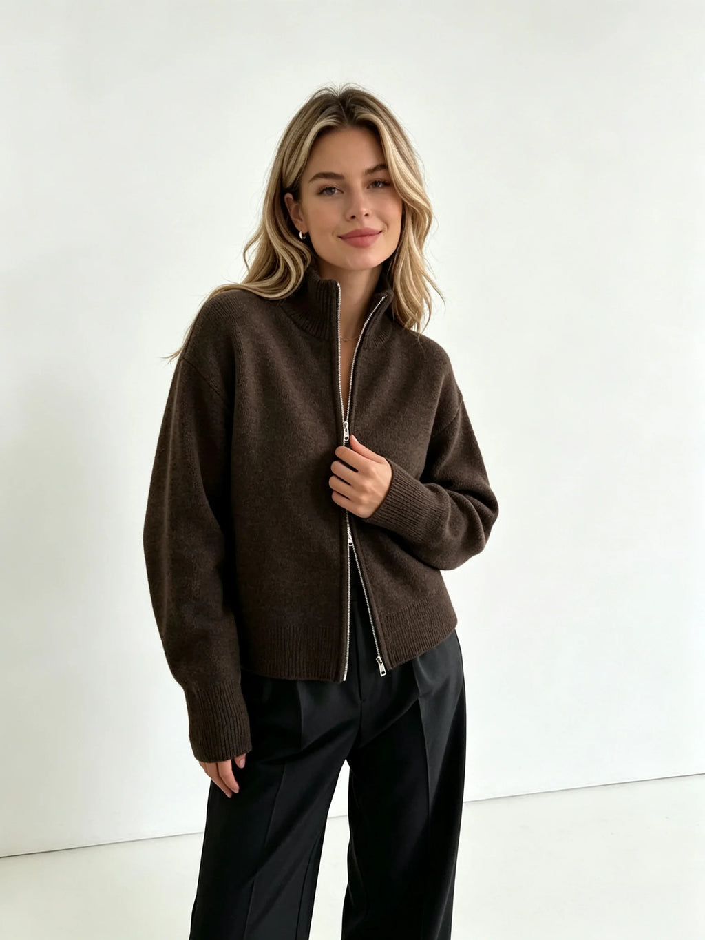 Dark brown zip up cardigan with black trousers, front view