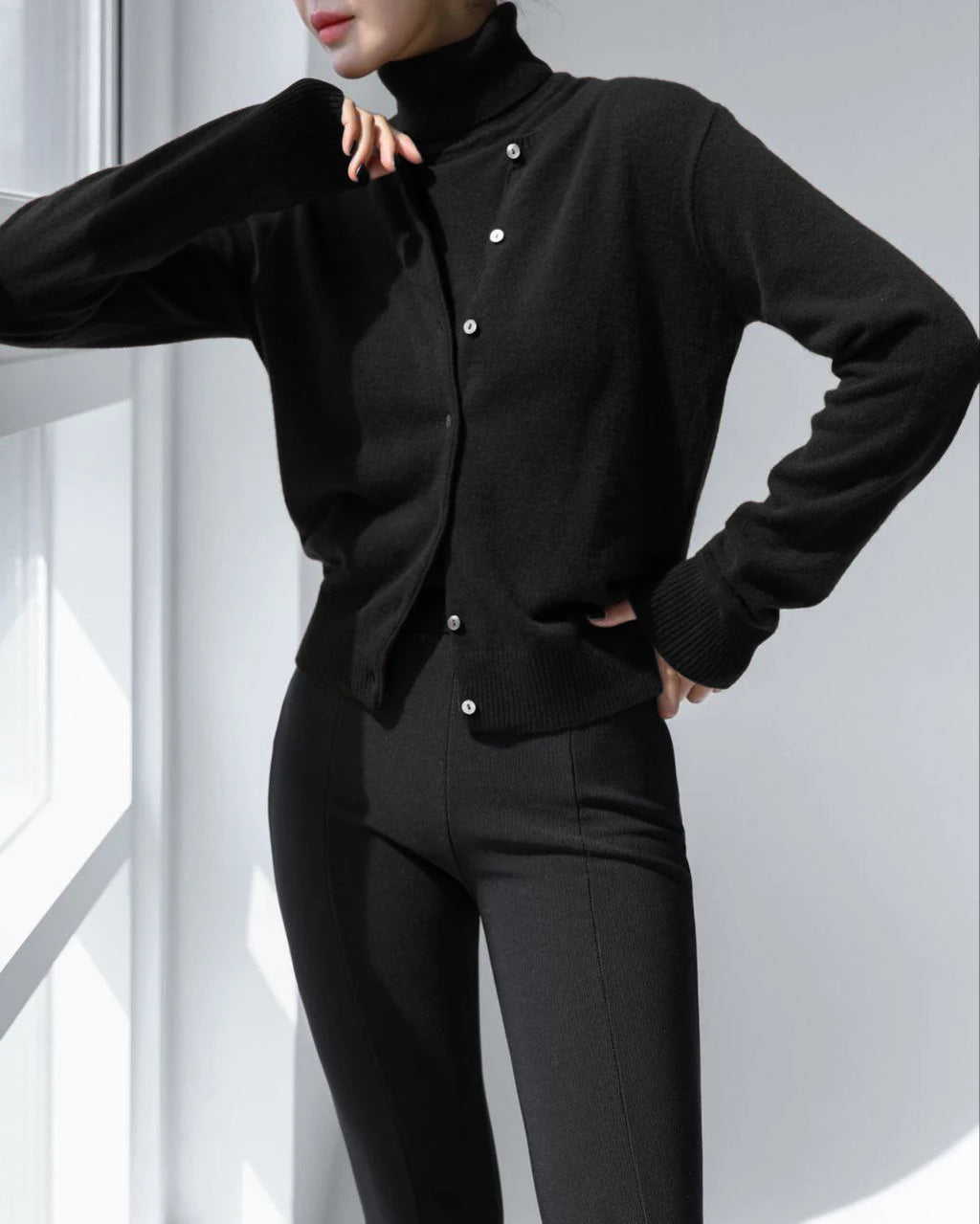 Black round neck button knit cardigan, front view