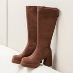Brown platform knee high boots with chunky block heel, side view