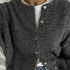 Close-up of a charcoal button front cardigan