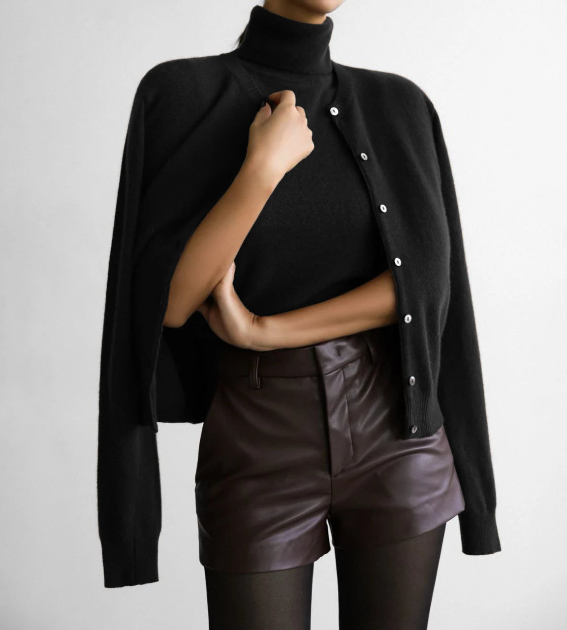 Black knit tank and cardigan set styled with shorts
