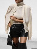 Cream knit tank and cardigan set styled with leather shorts