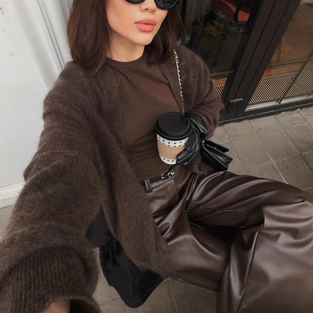 Chocolate brown knit cardigan worn with leather trousers