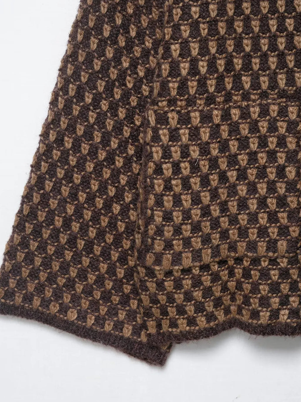 Brown and tan check knit texture and hem detail