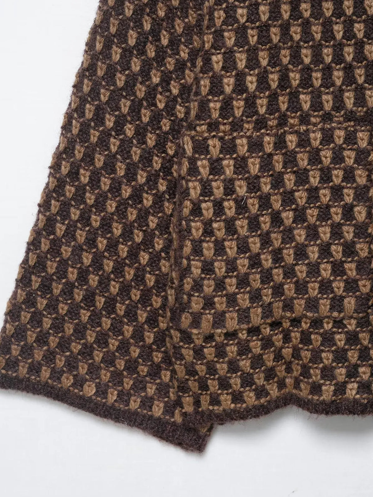 Brown and tan check knit texture and hem detail
