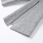 Close-up of the split flared sleeve on a grey knit cardigan