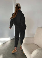 Black half button stand collar sweatshirt and jogger pants set, back view