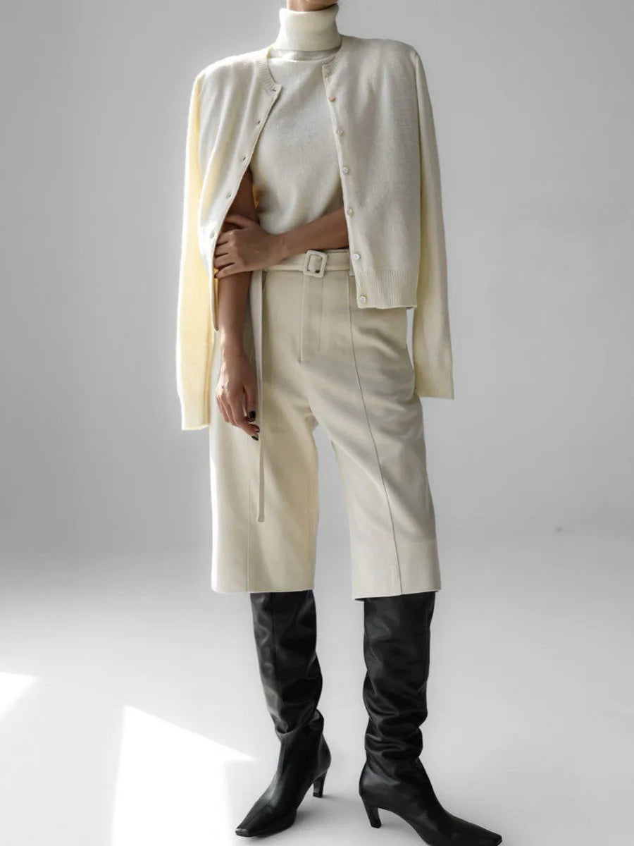 Cream knit tank and cardigan set styled with trousers and boots