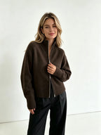 Dark brown zip up cardigan with high stand collar, front view