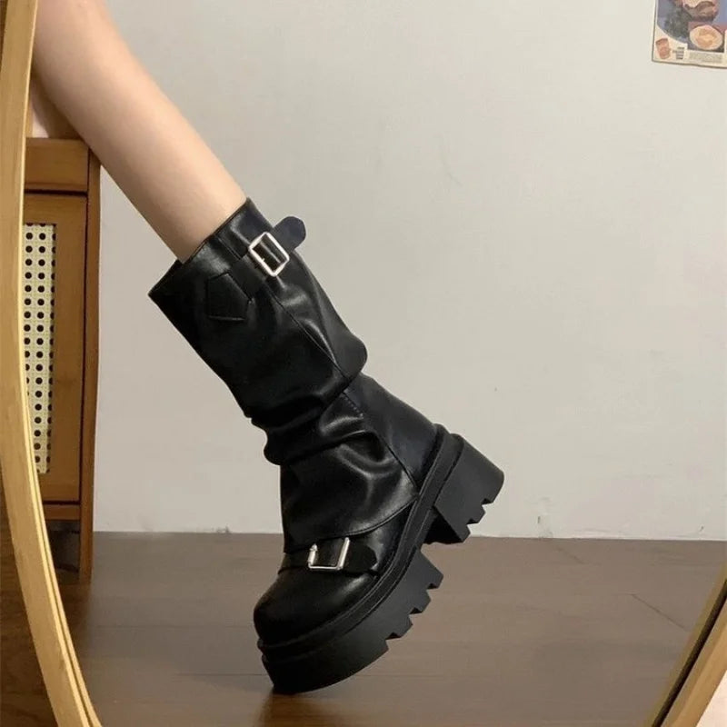 Black slouchy platform biker boots with buckle straps, side view