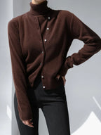 Chocolate brown button knit cardigan worn with trousers