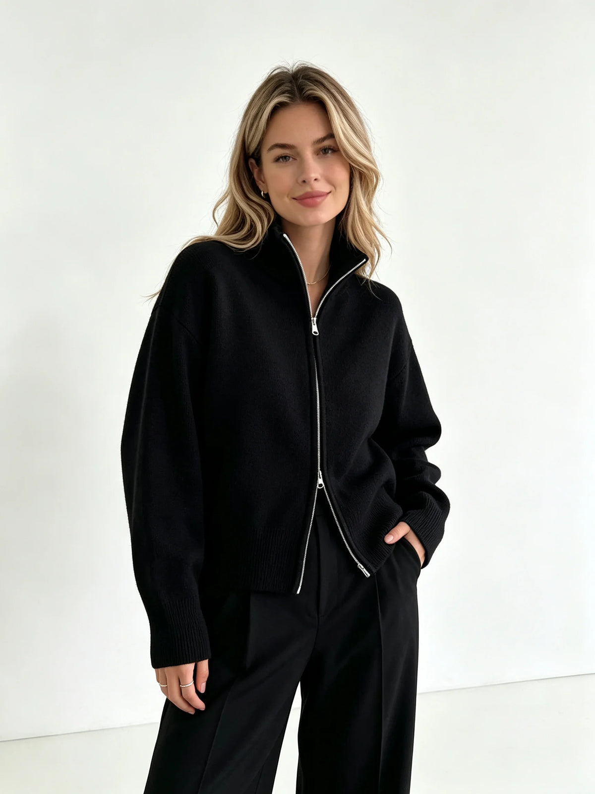 Black zip up cardigan with high stand collar, front view