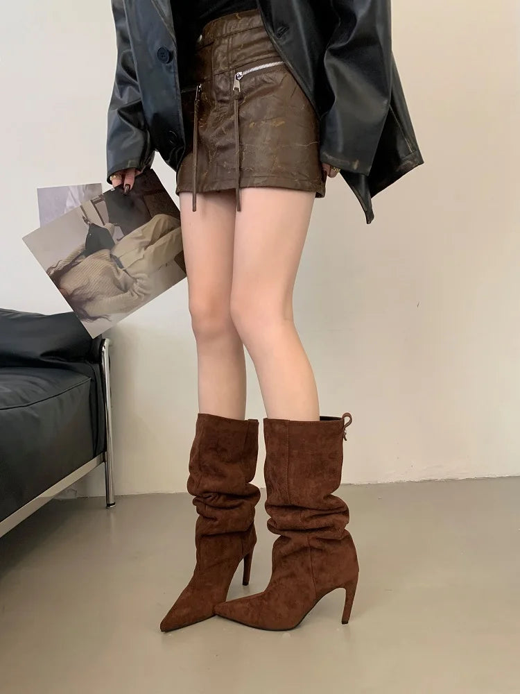 Chestnut flock slouch knee high boots with pointed toe and thin heel, worn