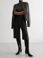 Charcoal knit tank and cardigan set styled with trousers and boots