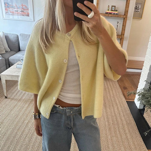 Lemon yellow short sleeve knit cardigan with jeans