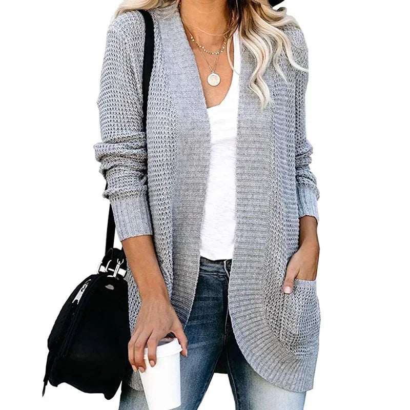 Light grey long open front cardigan worn with jeans