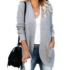 Light grey long open front cardigan worn with jeans