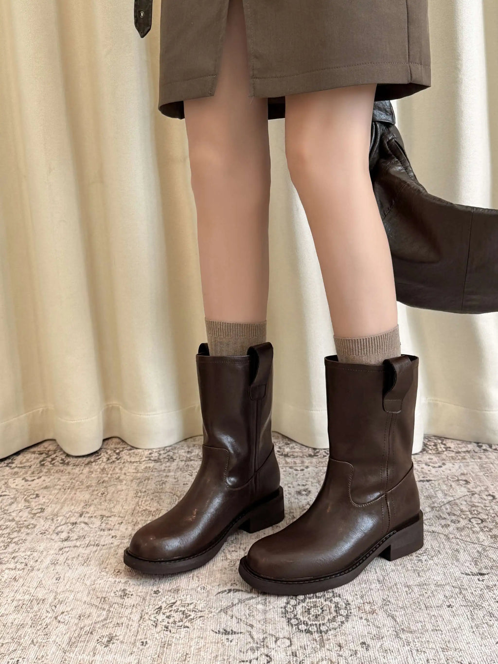 Dark brown leather mid calf western boots, front view