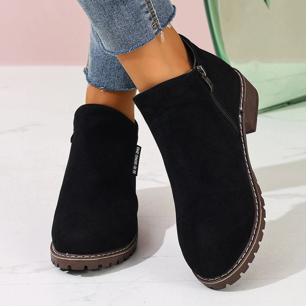 Black Chelsea-style ankle boots, front view