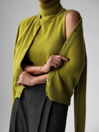 Lime green knit tank and cardigan set, cardigan draped off the shoulder