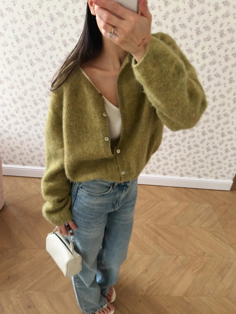 Moss green fuzzy knit button cardigan worn with jeans