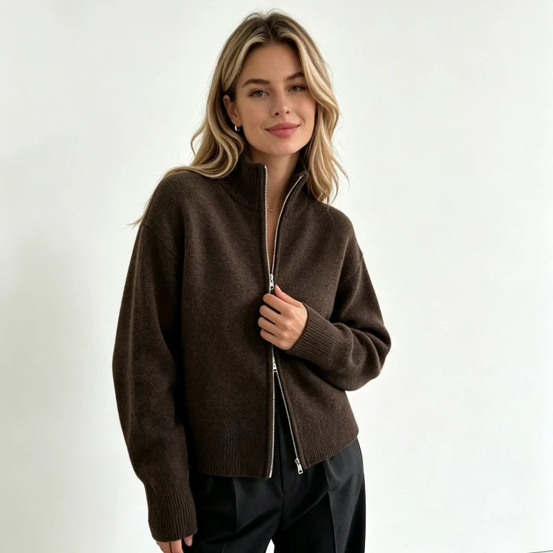 Dark brown zip up cardigan with stand collar and black trousers