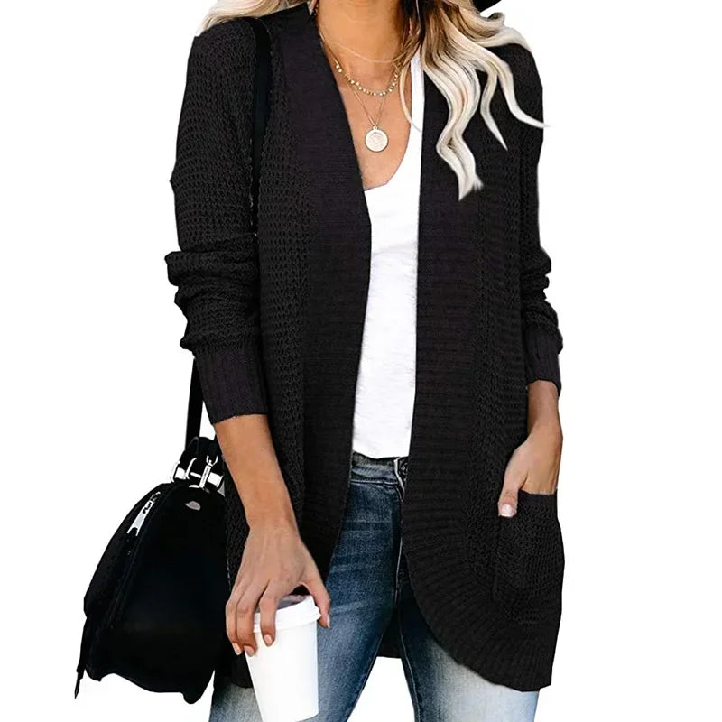 Black long open front cardigan worn with jeans