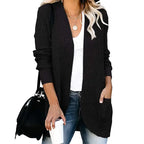 Black long open front cardigan worn with jeans