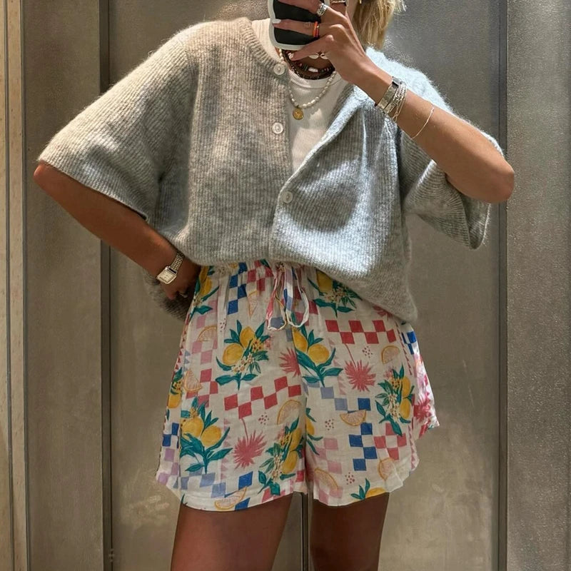 Grey short sleeve cardigan with colourful printed shorts