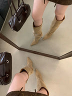 Sand flock slouch knee high boots with pointed toe and thin heel, worn