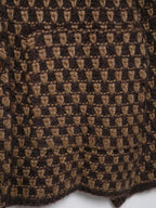 Close-up of the check knit stitch and patch pocket