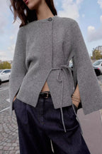 Grey tie side cardigan styled with dark trousers