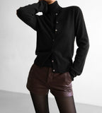 Black button knit cardigan styled with shorts