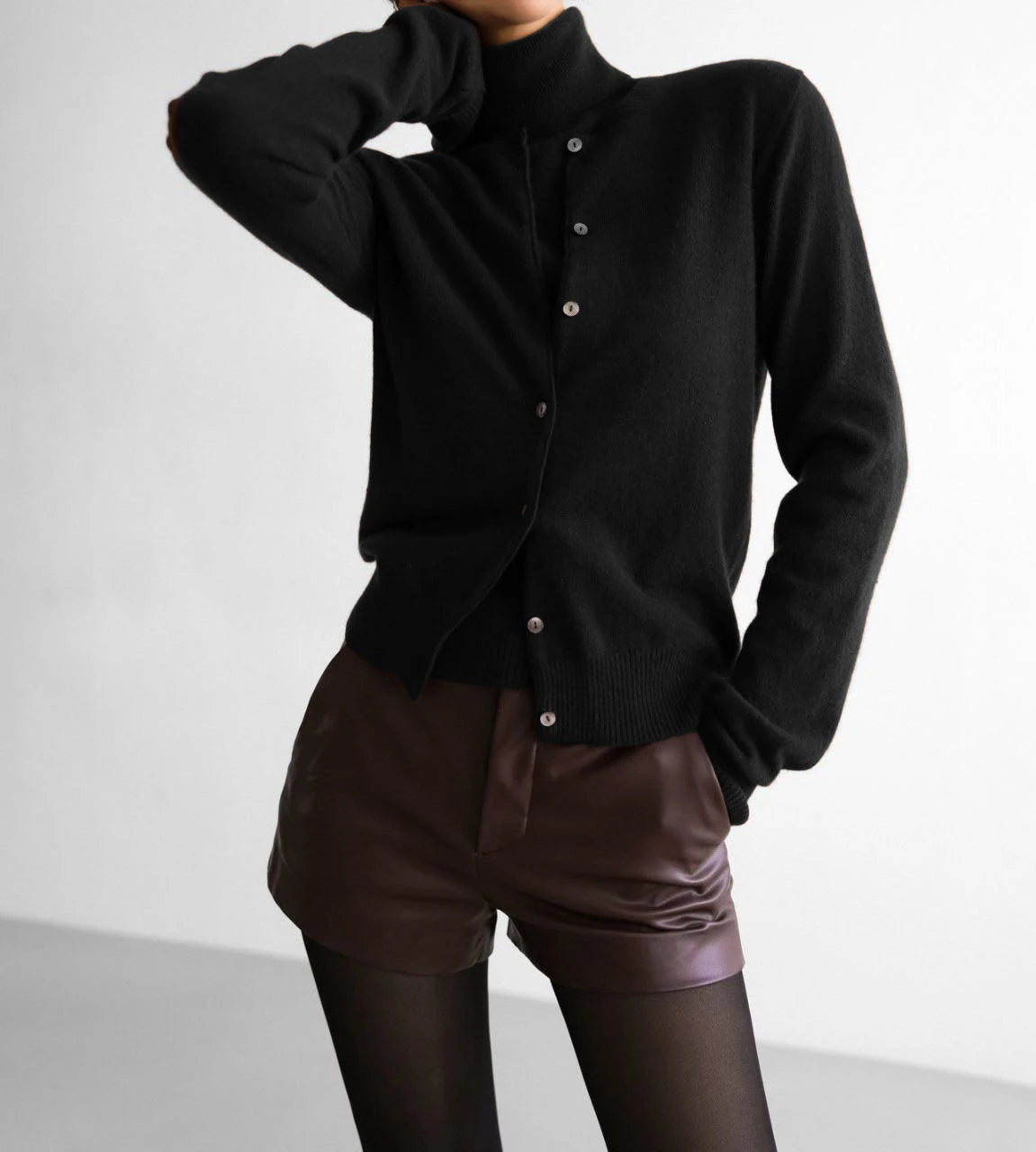 Black button knit cardigan styled with shorts