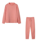 Coral pink high neck sweater and drawstring trouser set, flat lay