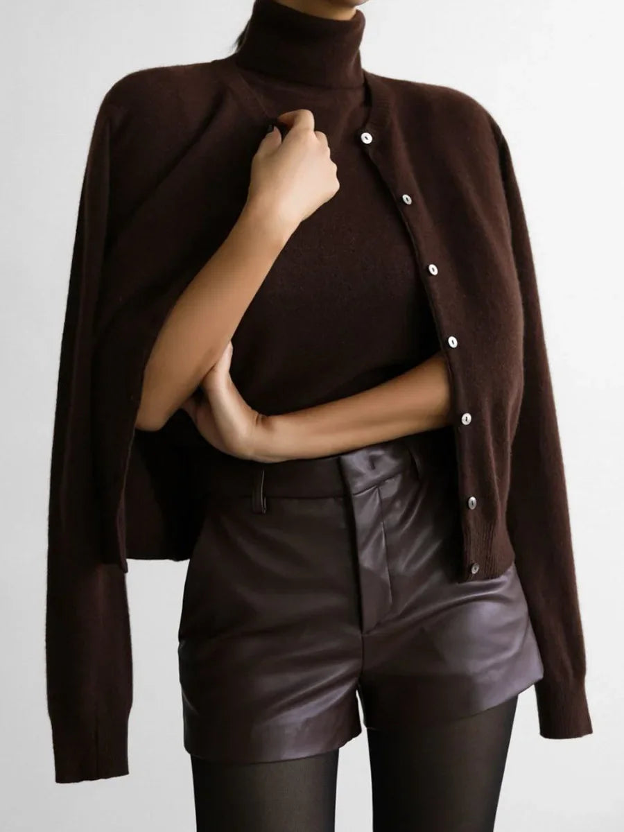Chocolate brown cardigan worn over the shoulders with a knit tank