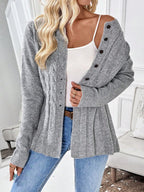 Grey cable knit button cardigan worn off the shoulder