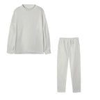 Cream high neck sweater and drawstring trouser set, flat lay