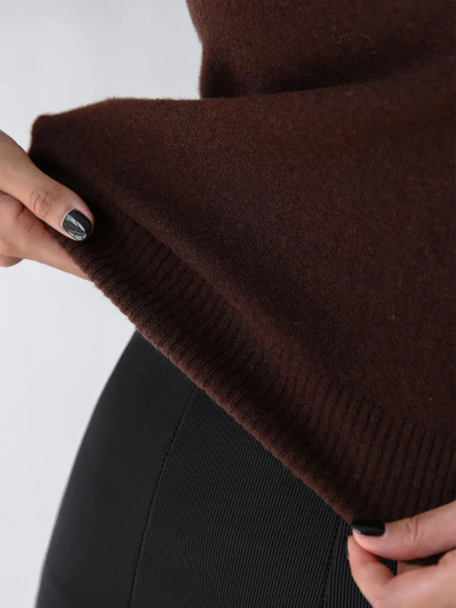 Close-up of the ribbed hem on a chocolate brown knit cardigan