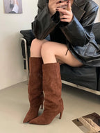 Chestnut flock slouch knee high boots with pointed toe and thin heel, worn