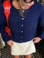 Navy button cardigan, cropped front view
