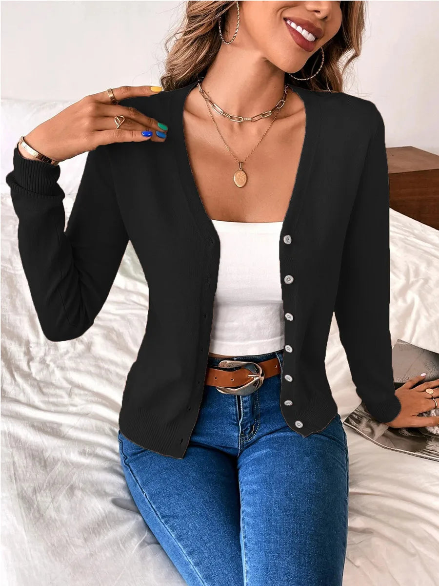 Black V neck button cardigan with a white cami and jeans