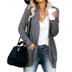 Grey long open front cardigan with pockets worn with jeans
