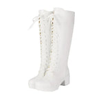 White lace-up knee high platform boots on a white background