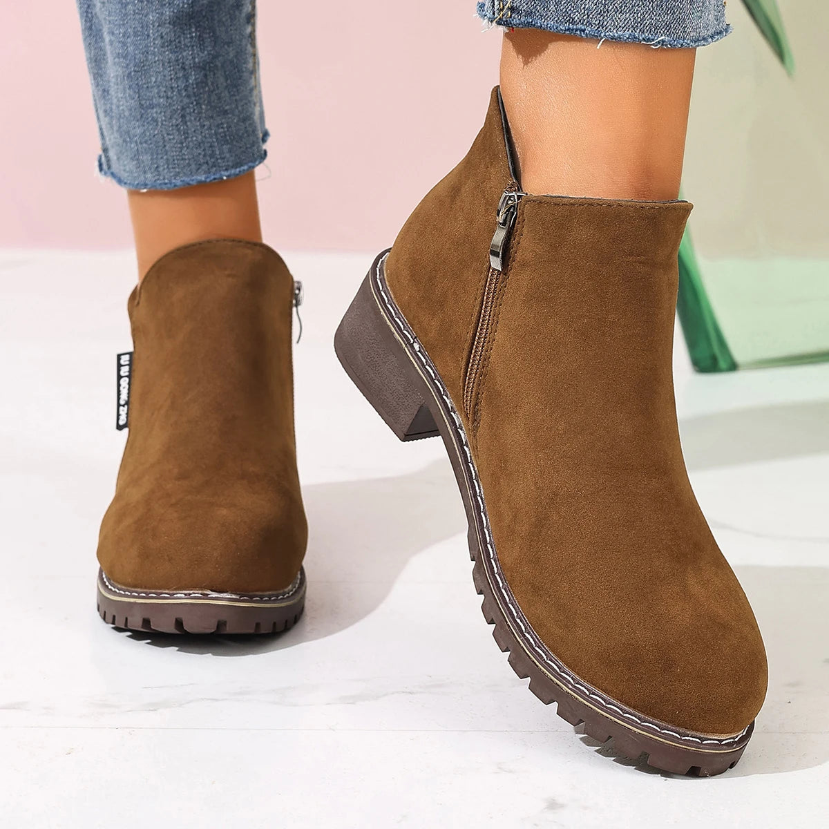 Brown ankle boots with chunky sole, side view