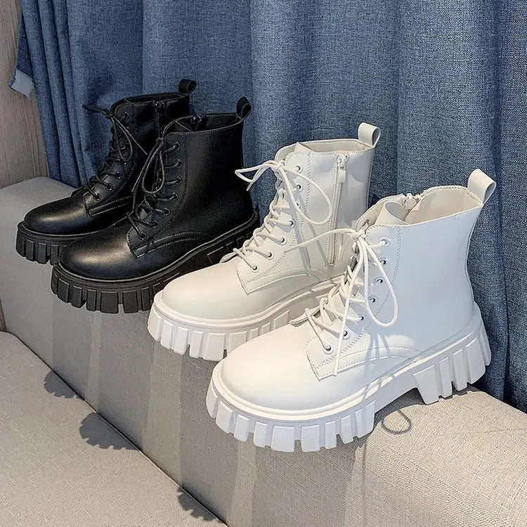 Black and white lace-up ankle boots with chunky sole side by side
